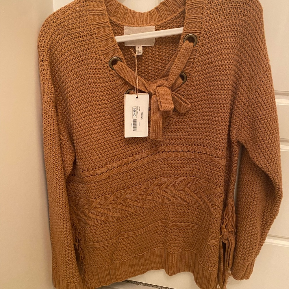 Boutique lace up sweater. New with tags.